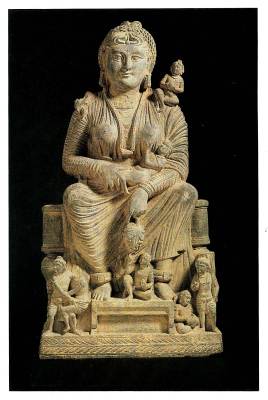 This Gandharan masterpiece, carved in a warm-toned schist, portrays Hariti  as the epitome of maternal grace, a regal yet figure.